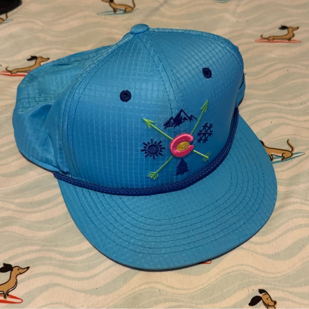 Blue Cap with Embroidered Design Snap Back